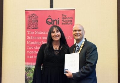 Angela weeks receiving her queens nursing title