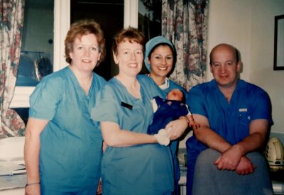 IVF team, including Ian Aird and a small baby.